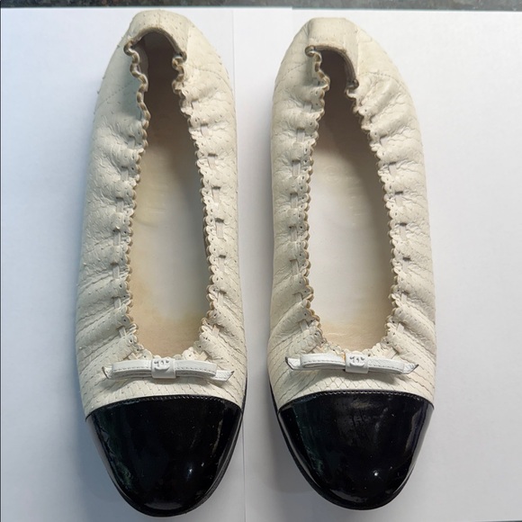 CHANEL Shoes - CHANEL White Leather Ballet Flats with Black Patent Cap Toe and Bow Accent